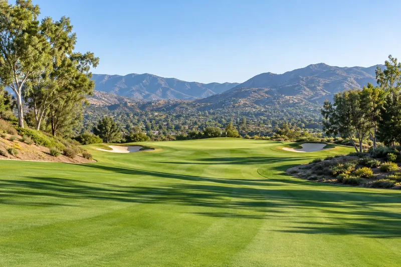 Empty golf fairway in morning light